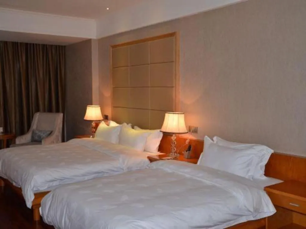 Bed in San Jiang Grand Hotel