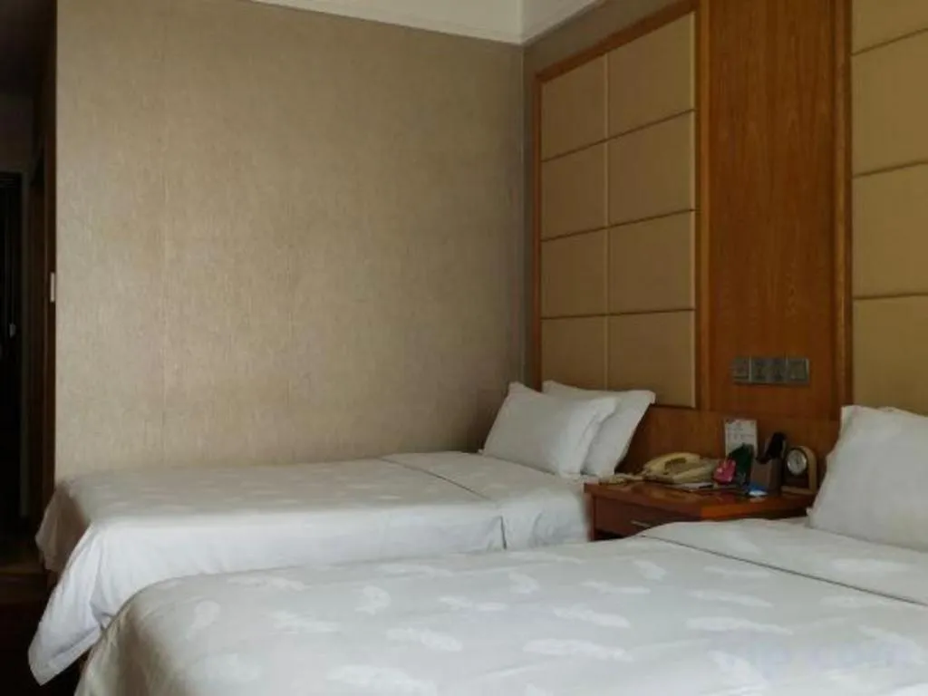 Bed in San Jiang Grand Hotel