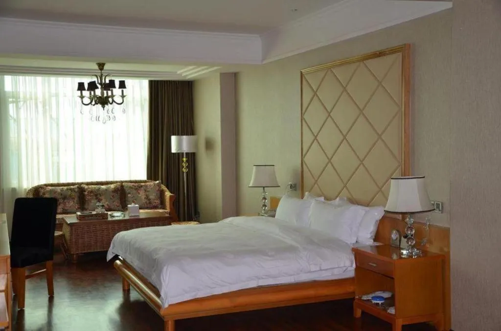 Bed in San Jiang Grand Hotel