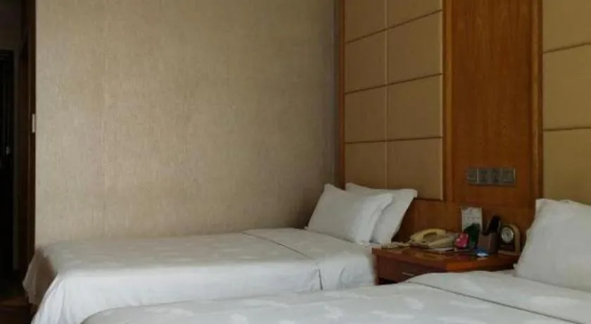 Bed in San Jiang Grand Hotel