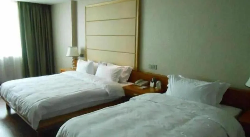 Bed in San Jiang Grand Hotel