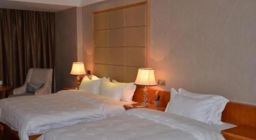 Bed in San Jiang Grand Hotel