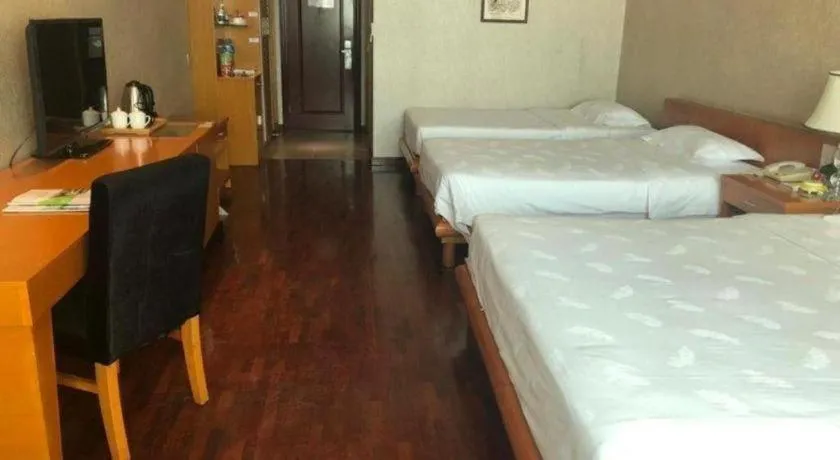 Bed in San Jiang Grand Hotel