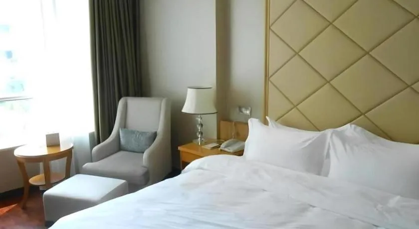 Bed in San Jiang Grand Hotel