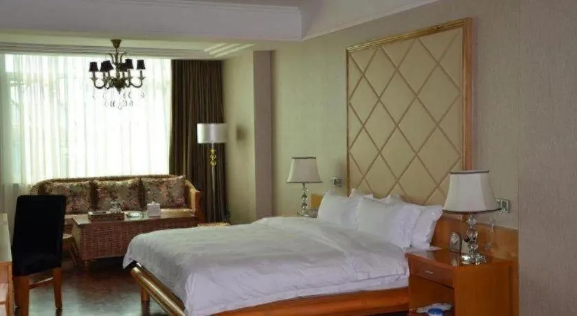 Bed in San Jiang Grand Hotel