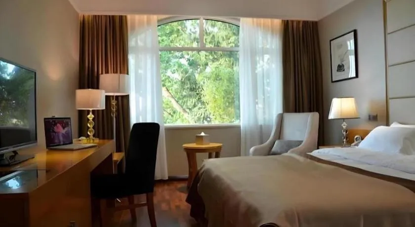 Bed in San Jiang Grand Hotel