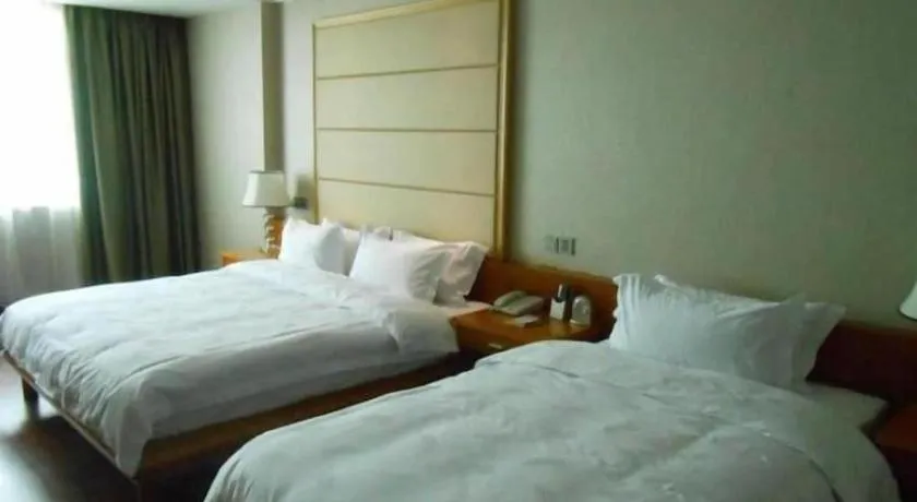 Bed in San Jiang Grand Hotel