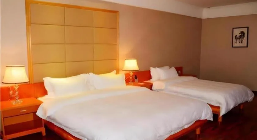 Bed in San Jiang Grand Hotel