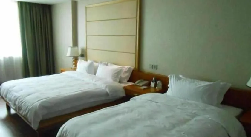 Bed in San Jiang Grand Hotel