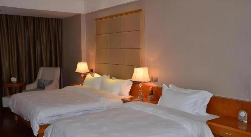 Bed in San Jiang Grand Hotel