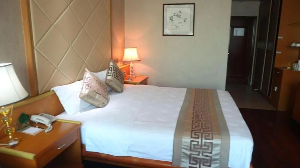 Bed in San Jiang Grand Hotel