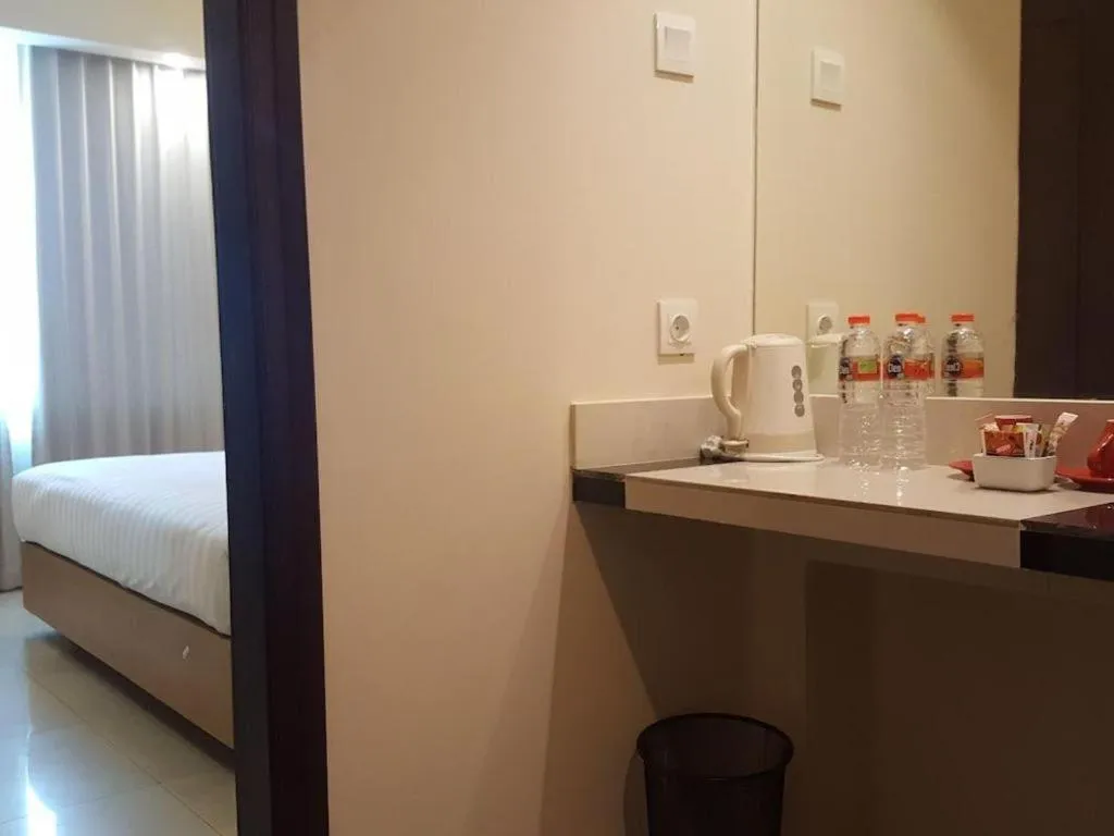 Bed in Kharisma Hotel