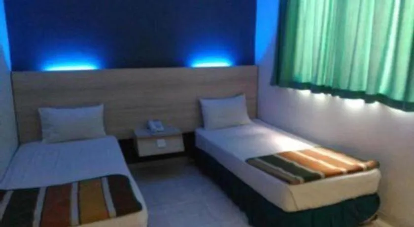 Bed in Kharisma Hotel