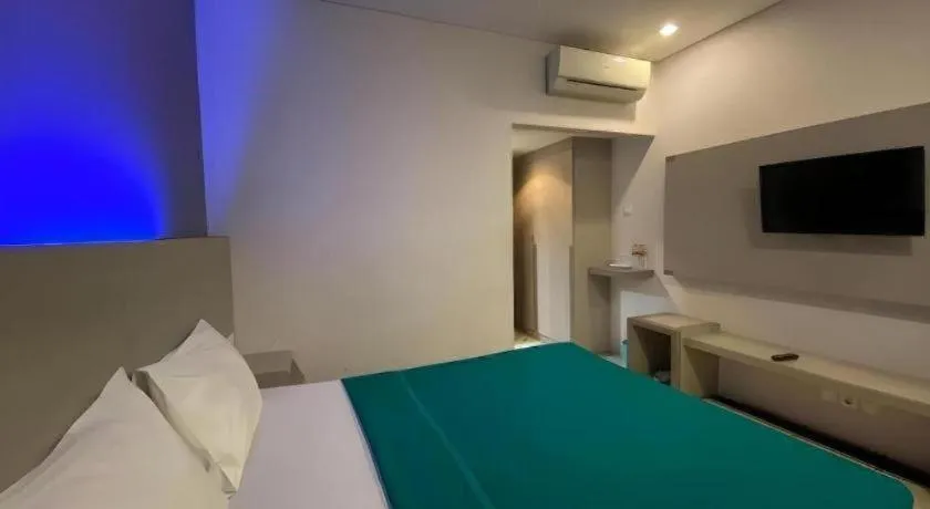 Bed in Kharisma Hotel