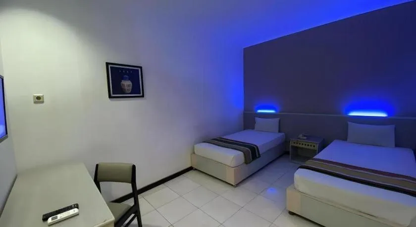 Bed in Kharisma Hotel