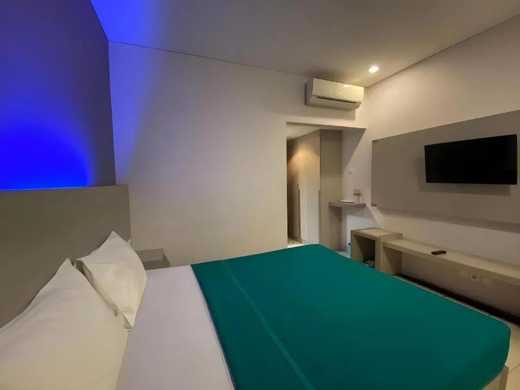 Bed in Kharisma Hotel