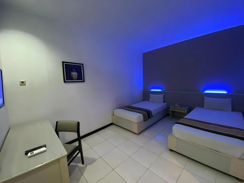 Bed in Kharisma Hotel