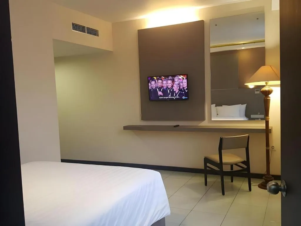 Bed in Kharisma Hotel