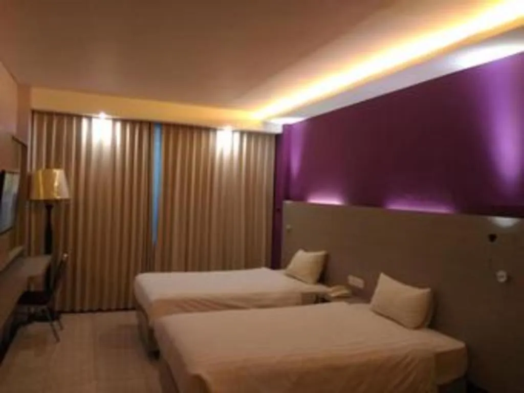 Bed in Kharisma Hotel