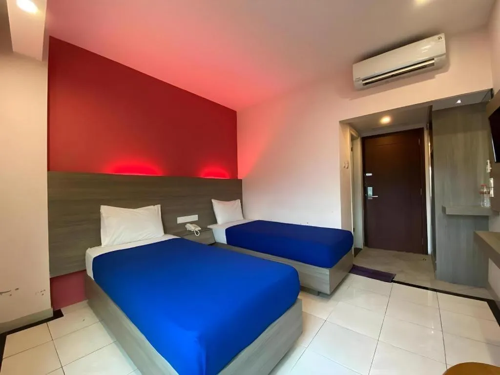 Bed in Kharisma Hotel