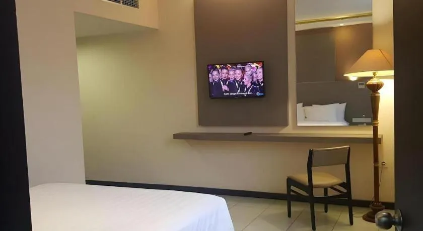 Bed in Kharisma Hotel