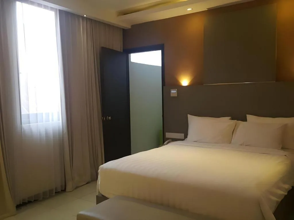 Bed in Kharisma Hotel