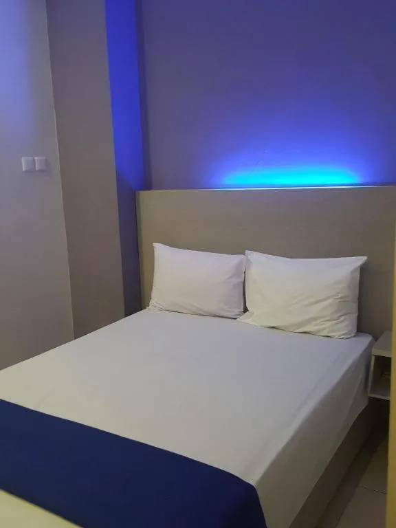 Bed in Kharisma Hotel