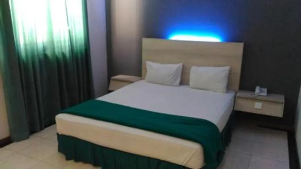 Bed in Kharisma Hotel