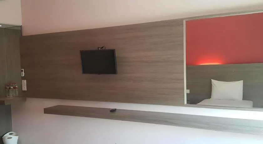 Bed in Kharisma Hotel