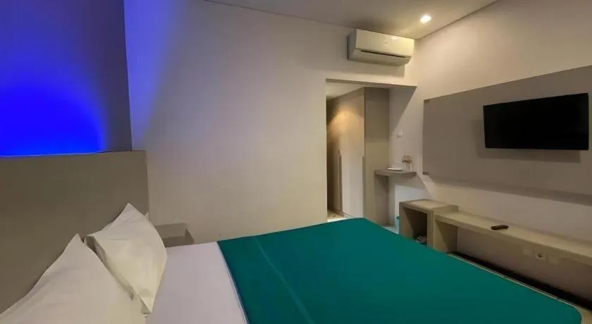 Bed in Kharisma Hotel