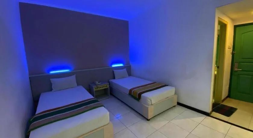 Bed in Kharisma Hotel