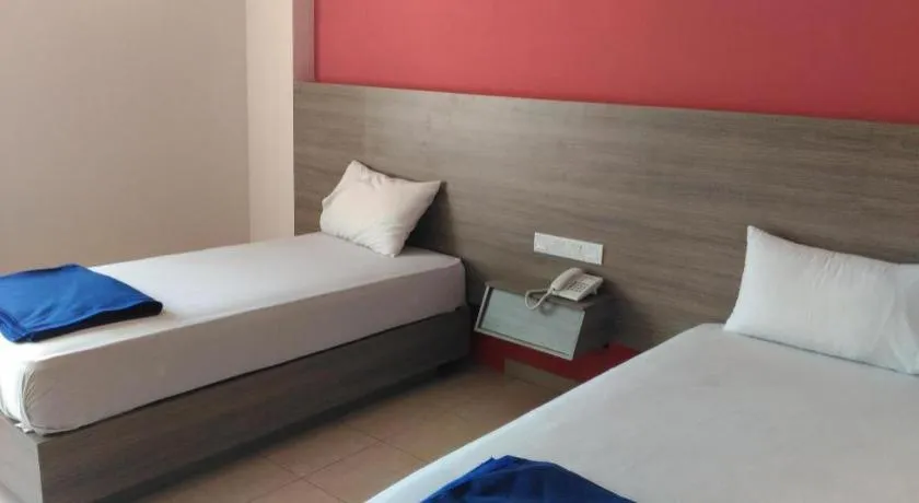 Bed in Kharisma Hotel