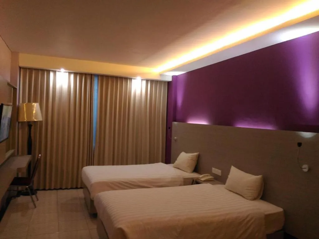 Bed in Kharisma Hotel