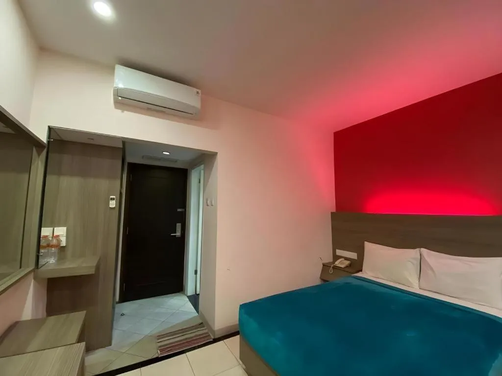 Bed in Kharisma Hotel