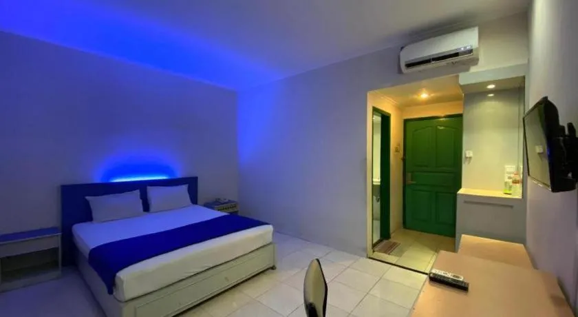 Bed in Kharisma Hotel