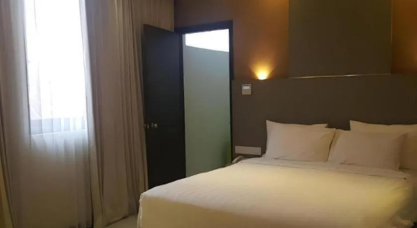 Bed in Kharisma Hotel