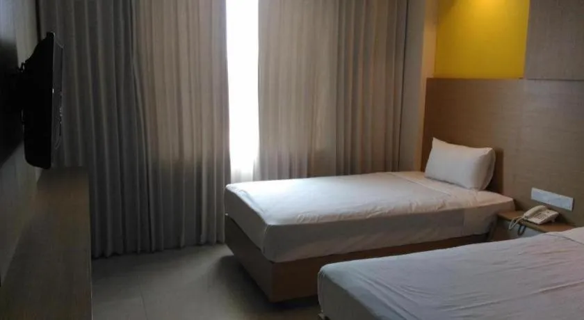 Bed in Kharisma Hotel