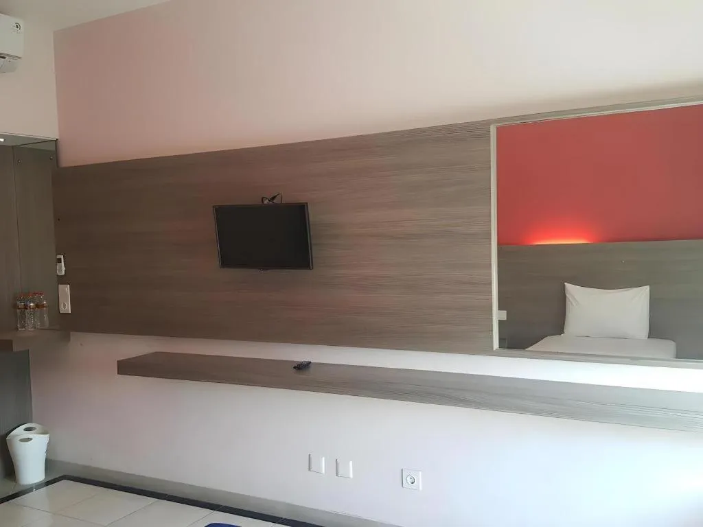 Bed in Kharisma Hotel