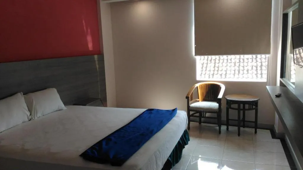 Bed in Kharisma Hotel