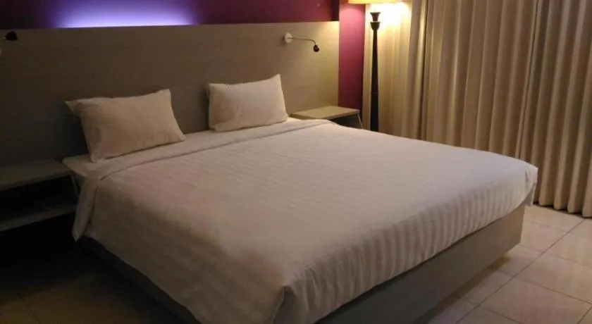 Bed in Kharisma Hotel
