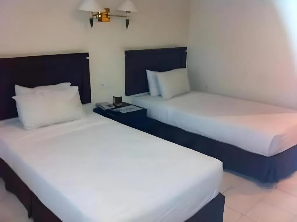 Bed in Guntur Hotel