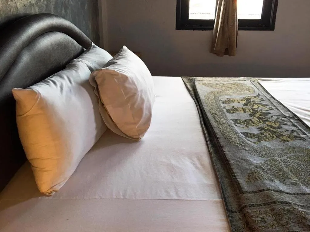 Bed in Sritrang Hotel