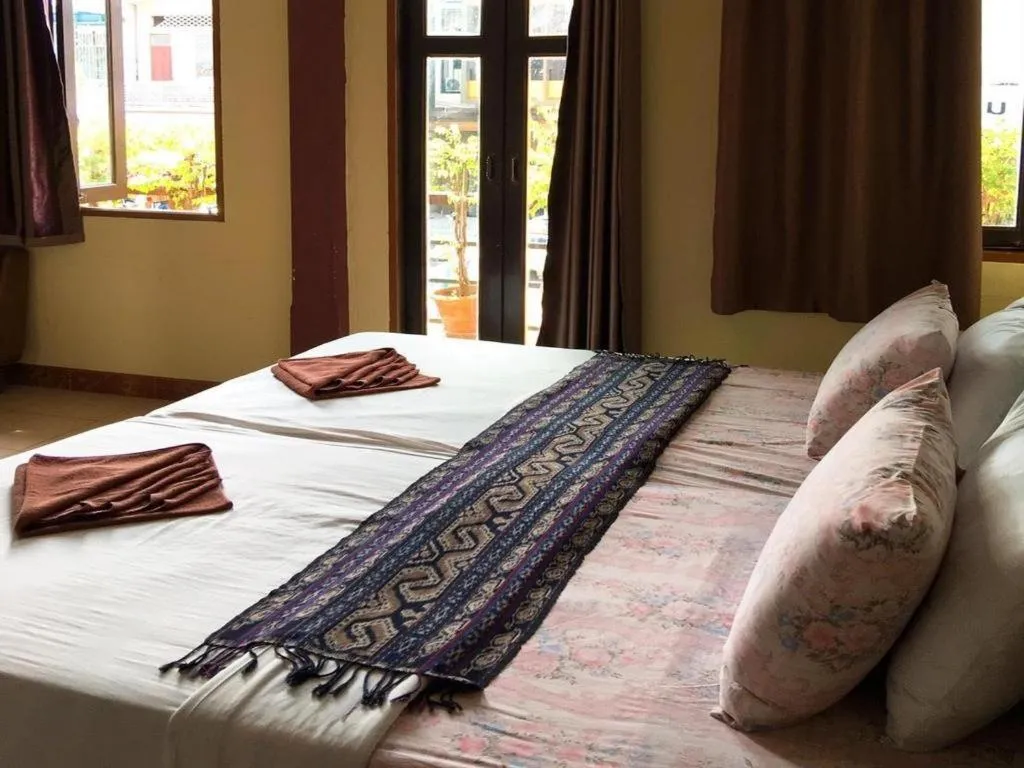 Bed in Sritrang Hotel