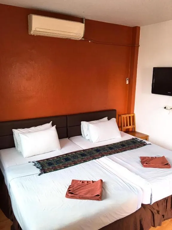 Bed in Sritrang Hotel
