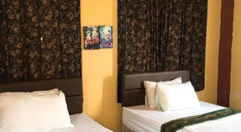 Bed in Sritrang Hotel