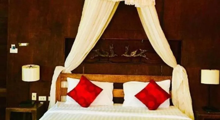Bed in Chivaree Hotel and Resort