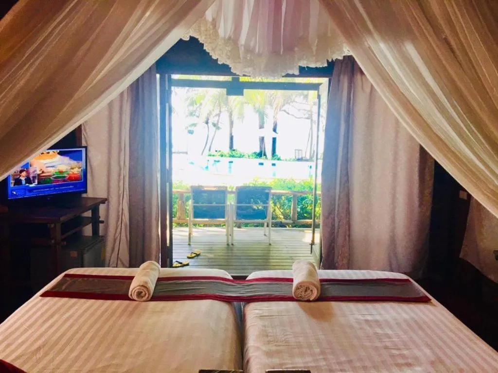Bed in Chivaree Hotel and Resort