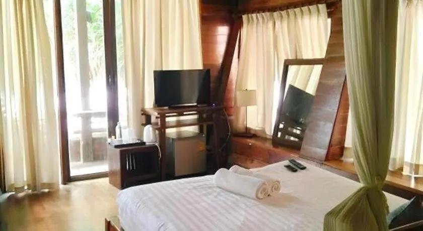 Bed in Chivaree Hotel and Resort