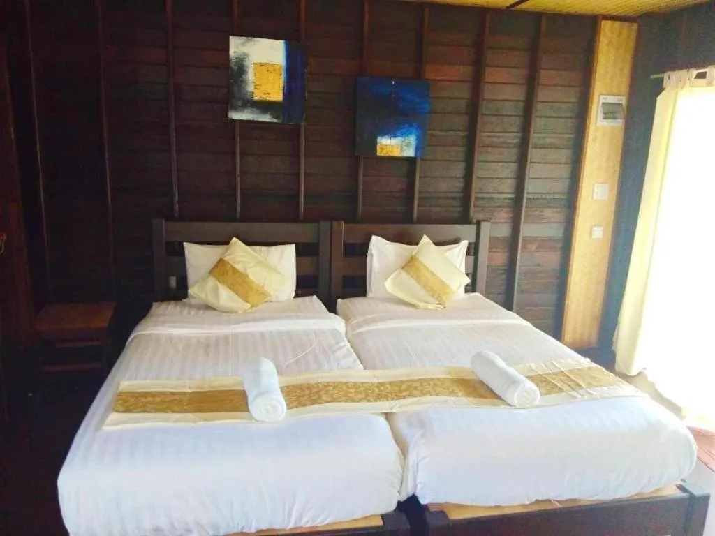Bed in Chivaree Hotel and Resort