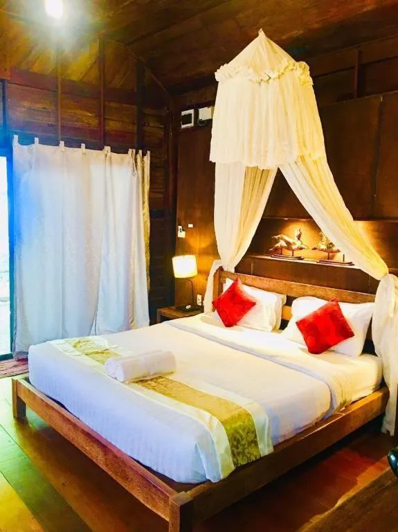 Bed in Chivaree Hotel and Resort